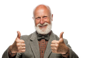 Old man with a big beard and a smile on white background
